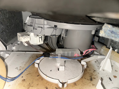 Dishwasher pump area and connected water hoses