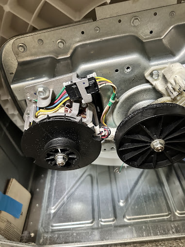Washer motor and drive pulley with the cabinet open